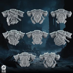 May include: A collection of eight grey resin miniature backpack components for tabletop gaming figures. Each piece features distinct sculpted details including animal skulls, intricate Celtic-style knotwork, and various metallic-looking textures.
