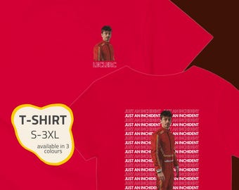 May include: Red t-shirt with the text "T-SHIRT S-3XL" in a yellow bubble. The shirt features a portrait of a person in a red racing suit and the text "LECLERC". The back of the shirt has the text "JUST AN INCHIDENT".