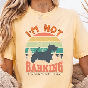 Our vintage-inspired Comfort Colors 1717 shirt was made for people lucky enough to share life with a Scottish Terrier — the bold little dog with huge confidence, strong opinions, and absolutely no interest in being corrected.

Featuring a Scottie dog silhouette layered over a distressed retro sunset graphic, this design captures the breed’s fearless, independent, and delightfully stubborn personality. The vintage sunset colors and weathered textures give it a classic worn-in look from day one.