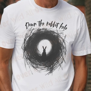 Venture Down the Rabbit Hole with our symbolic and conspiratorial Comfort Colors 1717 tee — designed for truth seekers, conspiracy enthusiasts, and anyone who loves diving deeper into the unknown. The graphic features the silhouette of a rabbit staring into a dark rabbit hole illustrated in a chaotic, almost frantic style—the edges drawn in a mad frenzy that perfectly captures the feeling of spiraling deeper into hidden truths and unanswered questions.