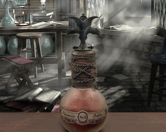 May include: A glass bottle with a brown liquid inside. The bottle has a metal top with a double-headed phoenix design. The label reads "Phoenix No. 4 Ashes".