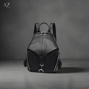designer black leather backpack silver zippers and HOOK & ALBERT shaped zip opens to a spacious Designer Backpacks | Luxury Leather