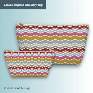 May include: Two canvas zippered accessory bags with a chevron pattern in shades of red, pink, blue, gray, and yellow. The bags are available in small and large sizes.