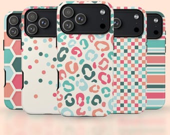 May include: A collection of five phone cases with various colorful patterns. Designs include a honeycomb, polka dots, leopard print, checkered, and striped pattern. The cases are in shades of pink, teal, orange, and white.