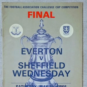 May include: A vintage football programme cover for the 1966 Football Association Challenge Cup Final. The cover features a blue illustration of the trophy, with the teams Everton and Sheffield Wednesday. The date is Saturday, May 14th, 1966.