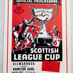 May include: A vintage Scottish League Cup official programme from 1960 featuring a red and black graphic of football players and a trophy. The text reads Official Programme, Scottish League Cup, Kilmarnock versus Hamilton Acad., and 6d.
