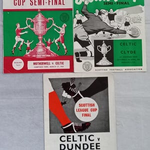 May include: Three vintage football programmes featuring the Scottish Cup Semi-Finals and League Cup Final. The covers display illustrations of players, the trophy, and text including Motherwell v. Celtic, Celtic v. Clyde, and Celtic v. Dundee.
