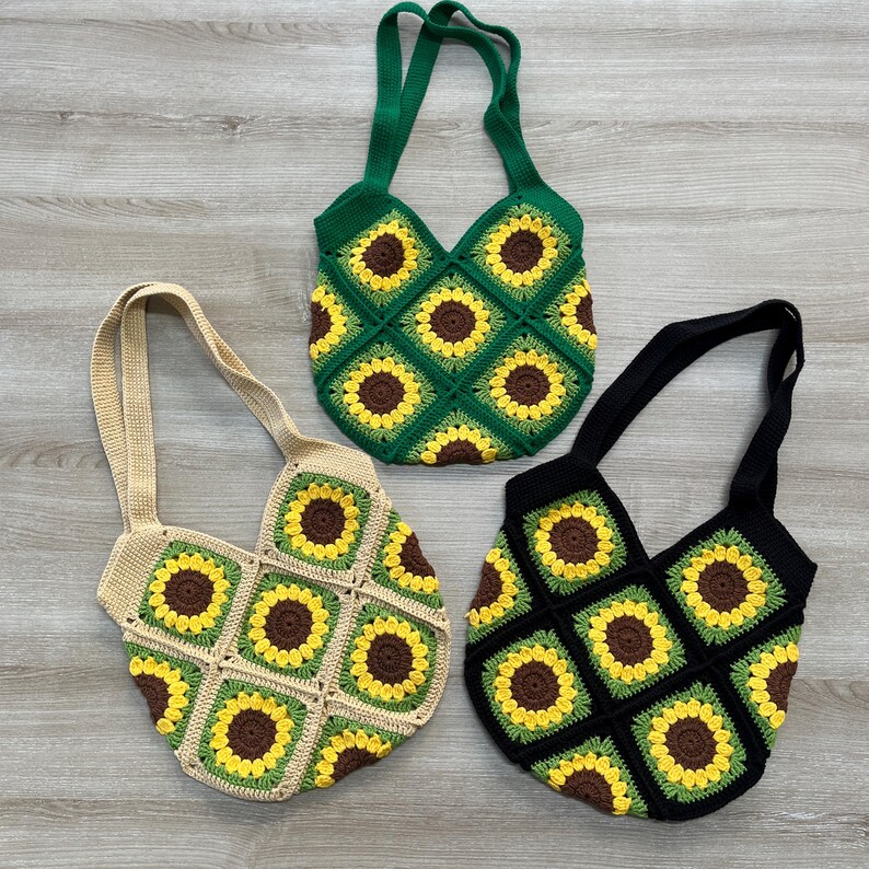 May include: Three crocheted tote bags with sunflower designs. The bags are in green, black, and beige.