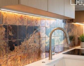 Azulejos de cobre hechos a mano: revestimientos art déco para salpicaderos de cocina y chimeneas.