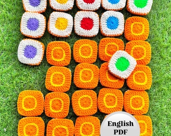May include: A collection of colorful, crocheted square motifs in various colors, including purple, yellow, red, blue, green, and orange. The squares are arranged on a green surface. The image includes a white circle with the text "English PDF Pattern".