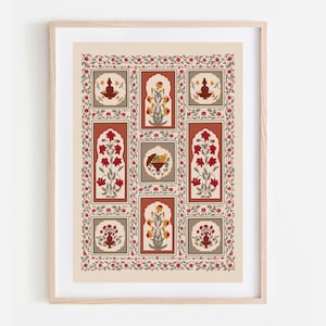 May include: A framed print featuring a repeating pattern of floral motifs in red, yellow, and brown against a cream background. The design includes stylized flowers and decorative elements within rectangular and square frames, surrounded by a floral border.