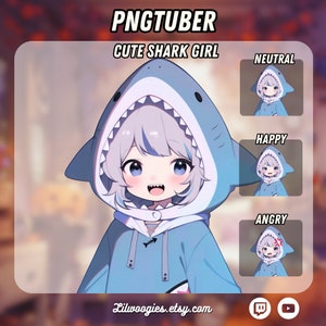 May include: A digital illustration of a cute cartoon girl with light blue hair wearing a blue shark hoodie. The girl has a happy expression and is looking at the viewer. The image includes the text "PNGTUBER CUTE SHARK GIRL" and "Lilwoogies.etsy.com".