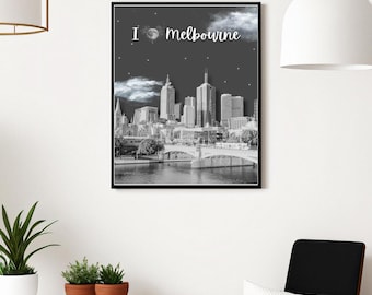 May include: Black and white framed print featuring the Melbourne skyline. The image includes the text "I love Melbourne" in white script. The print shows a bridge, buildings, and a dark sky with clouds.