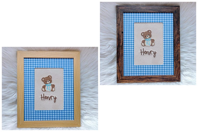 May include: Two framed pictures with a blue and white gingham background. Each frame holds a beige rectangle with a brown teddy bear and the name "Henry" embroidered in brown. One frame is light wood, the other is dark wood.