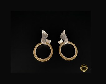 Elevate your collection with luxurious piece. The top displays an organic shape with circular hoop accented by a pave-set ring of crystals.