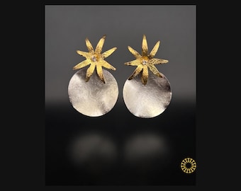 Elevate your look with these earrings. The petals have a fine texture, centered with a single shimmering clear stone for a touch of light.