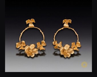 Letting one standout piece—like this floral earrings—take center stage while the others play a supporting role. 24k handcrafted gold-plated