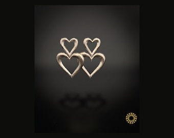 Elevate your style with these stunning Double Heart Statement Earrings. They blend romantic symbolism with a modern, artistic flair.