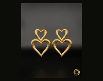 Elevate your style with these stunning Double Heart Statement Earrings. They blend romantic symbolism with a modern, artistic flair.