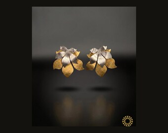 Wear these striking handcrafted leaf-motif earrings feature a layered, bi-color design that creates a bold, organic silhouette.