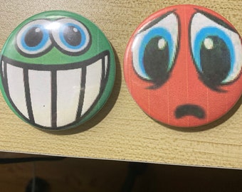 Silly goober pins based of the toys from Regretevator! Distressed Red Ball and Silly Green Grinner