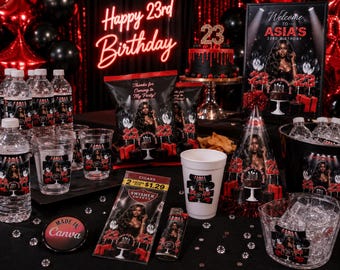 May include: A birthday party setup with black and red decorations, including a cake, snacks, and drinks. The neon sign reads "Happy 23rd Birthday". The scene includes water bottles, cups, and party favors with a woman's image.