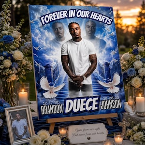 May include: A memorial display featuring a portrait with the text "FOREVER IN OUR HEARTS." The portrait includes the name "BRANDON DUECE JOHNSON" and dates 12-17-90 to 08-28-23. The display is surrounded by flowers, candles, and a framed photo.