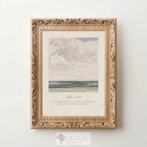 May include: A framed print with a watercolor painting of a landscape with a cloudy sky and a field in the distance. The print includes the text "John 16:33" and the quote "In the world you will have tribulation, but take heart: I have overcome the world." The print also includes the text "Weathered by Grace Scripture Art".