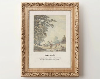 Puede incluir: Una impresión enmarcada con una ilustración vintage de ciervos en un bosque. La impresión incluye el texto "Salmo 42:1" y el versículo "Como el ciervo anhela las corrientes de agua, así mi alma te anhela a ti, oh Dios."