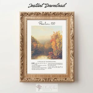 May include: A framed wall art print featuring a landscape painting of an autumn forest by a river. The text reads Psalm 100, A PSALM OF THANKSGIVING, and the full biblical passage. The frame is light wood with an ornate, carved floral pattern.