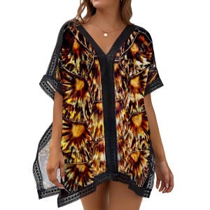 May include: A short-sleeved, V-neck cover-up with a unique pattern in shades of brown, yellow, and orange. The cover-up has black trim along the neckline, sleeves, and hem, with a delicate lace detail. The fabric appears lightweight and flowing.