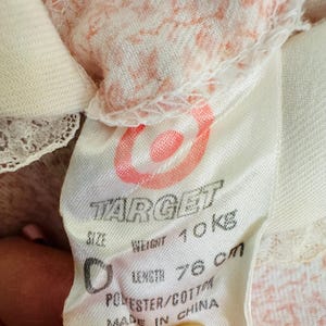 May include: A white tag with the Target logo and the text "Size", "Weight 10kg", "Length 76cm", "Polyester/Cotton", and "Made in China".