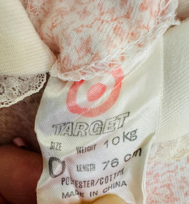 May include: A white tag with the Target logo and the text "Size", "Weight 10kg", "Length 76cm", "Polyester/Cotton", and "Made in China".
