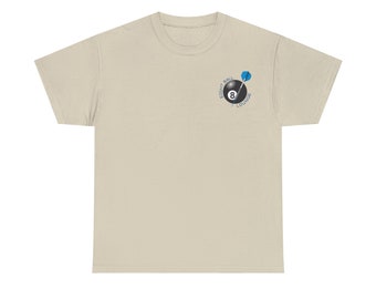 May include: A beige t-shirt featuring a small graphic on the upper left chest. The graphic includes a black eight ball with a blue dart and the words "EIGHT BALL LOUNGE" in a circular design. The shirt is made of a soft material.