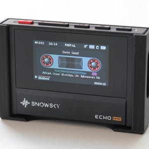 May include: Black Echo Mini digital audio player with a screen displaying a cassette tape graphic and the text "Swim Good". The player has a red button and the Snowsky logo.