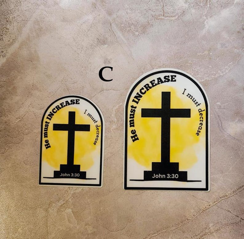May include: Two yellow and black stickers with a cross and the text "He must increase, I must decrease" and "John 3:30".