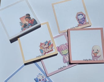 May include: A collection of square sticky notes with various illustrations and text. Designs include a person reading, a vampire in a coffin, a ghost with a pumpkin, a character with pink hair, and the text "Fall Vibes". Each note has a colored border.