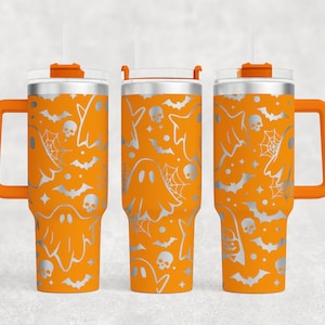 May include: Three orange stainless steel tumblers with a silver ghost and bat pattern. Each tumbler has a lid and a handle.