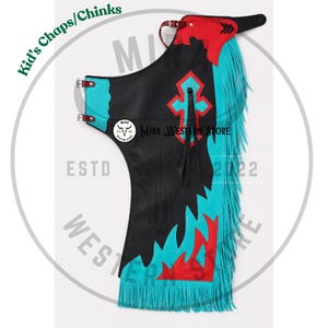 May include: Black leather chaps for children featuring bright turquoise and red accents, a cross applique, long turquoise fringe along the side, and adjustable buckle straps. The design includes the text Kid's Chaps/Chinks and MIRA WESTERN STORE.
