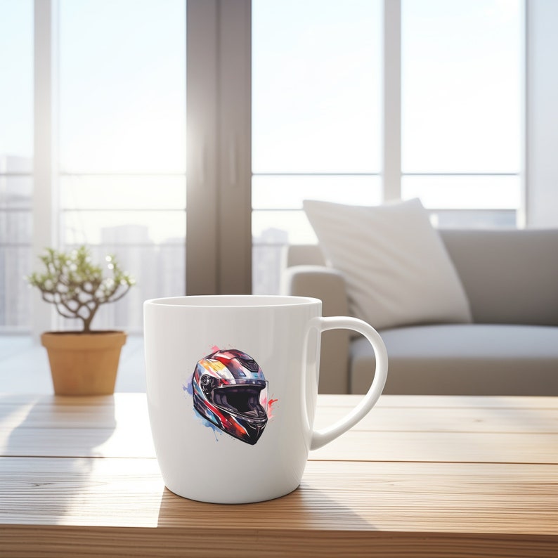 May include: White ceramic mug with a colorful illustration of a motorcycle helmet. The helmet is painted in shades of red, blue, and black with a white visor. The illustration is surrounded by watercolor-like splatters.