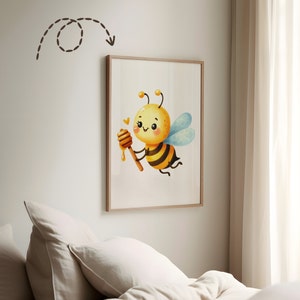 May include: A framed illustration of a cartoon bee holding a honey dipper. The bee is yellow and black with a smiling face and blue wings. The background is white.