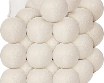 May include: A set of 24 white wool dryer balls. The balls are arranged in a pyramid shape.