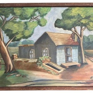 May include: A painting of a small, blue house with a brown roof, surrounded by green trees. The house has a small porch and a window with a flower box. The painting is framed in a brown wooden frame.