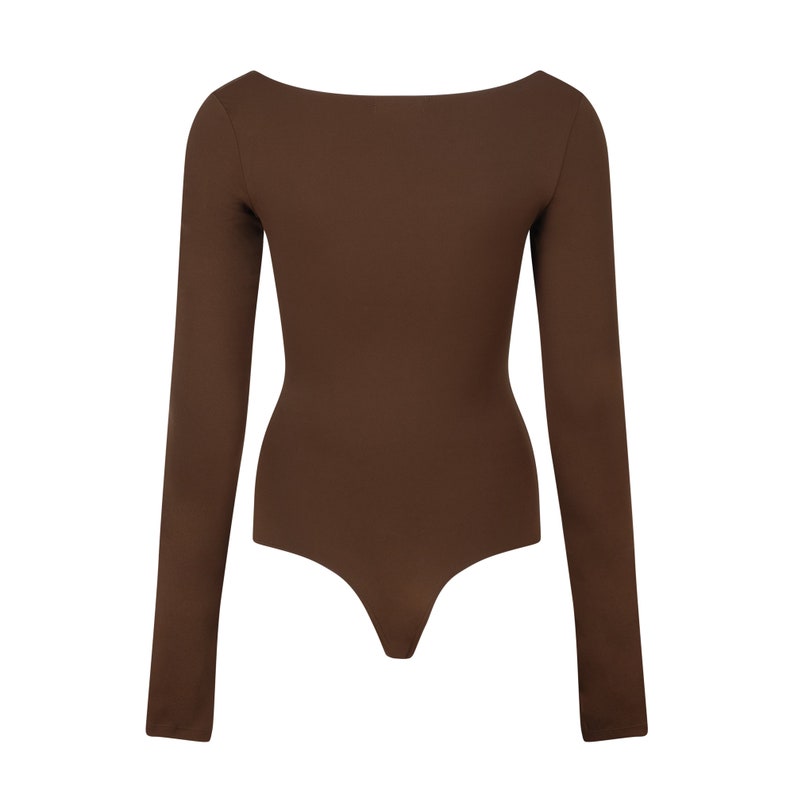 May include: A brown long-sleeved bodysuit with a scoop neck.