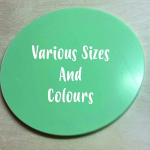 May include: A green round disc with the text "Various Sizes And Colours" in white.