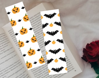 May include: Three Halloween themed bookmarks with a white background. One bookmark features a repeating pattern of orange pumpkins with black eyes and a black bat. The second bookmark features a repeating pattern of black bats with orange pumpkins. The third bookmark features a repeating pattern of black bats with orange pumpkins.