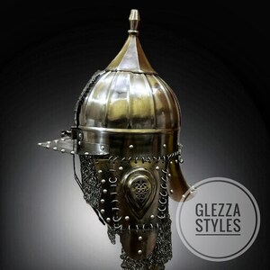 May include: A metallic, antique-style helmet with a rounded top and a pointed finial. The helmet features a visor, chainmail, and decorative rivets. The image includes the text "GLEZZA STYLES" in a circular logo.