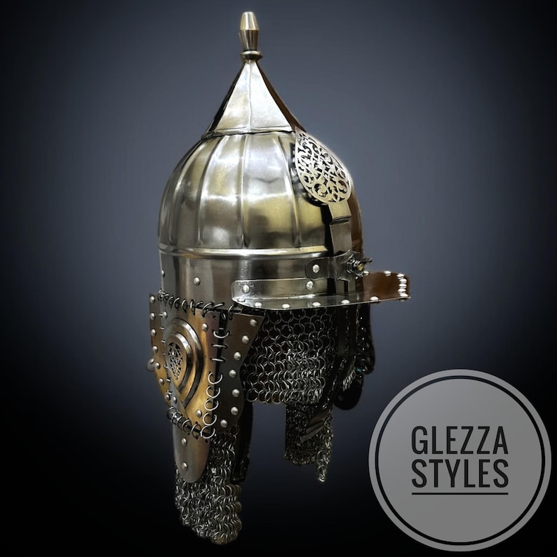 May include: A shiny metal helmet with a rounded crown and a small spike at the top. The helmet has ornate metal detailing and a chainmail neck protector. The image includes the text "GLEZZA STYLES" in a circular logo.