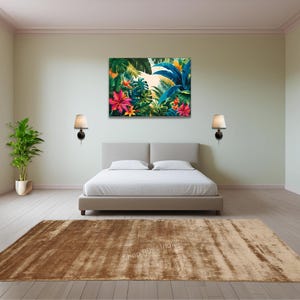 May include: A brown and beige area rug with a subtle distressed look. The rug is placed in a bedroom setting with a bed and two lamps on the wall.