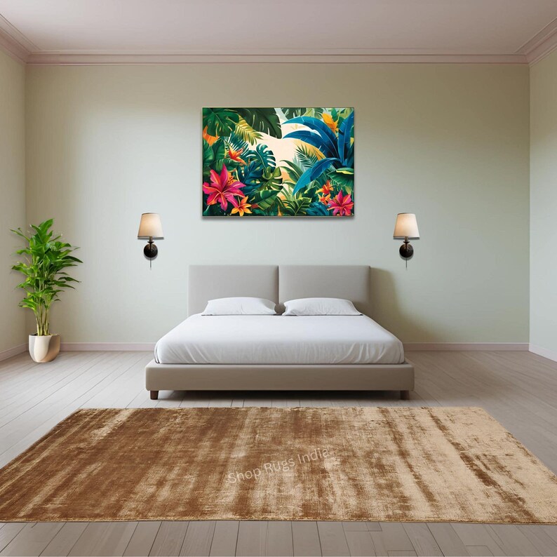 May include: A brown and beige area rug with a subtle distressed look. The rug is placed in a bedroom setting with a bed and two lamps on the wall.